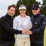 Rebecca Artis of Australia with her trophy and coaches Gary and Luke Edwin